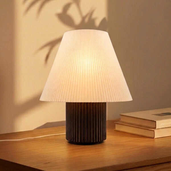 Modern sculptural table lamp with geometric silhouette and textured finish